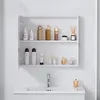 A white bathroom cabinet with shelves filled with various toiletries and a sink with a faucet below. Produktbild-Vorschau