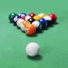 A rack of billiard balls on a green felt table, with one white ball in the foreground. Produktbild-Vorschau