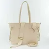 A cream-colored tote bag with embossed branding and a detachable strap, shown against a white background. Produktbild-Vorschau
