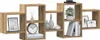A modular wooden wall shelf unit with various compartments, decorated with books, vases, a clock, and framed pictures. Náhľad obrázku produktu