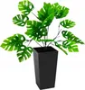 A green artificial plant in a black pot against a white background. Náhled obrázku produktu
