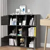 A gray wooden bookshelf with 9 compartments and 5 doors, filled with books, decorative items, and a globe. Náhľad obrázku produktu