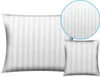 A white pillow with a striped pattern, shown in two sizes, with a magnified view of the pattern. Produktbild-Vorschau