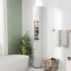 A bathroom scene with a tall, narrow white cabinet. Podgląd zdjęcia produktu