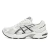 A side view of a single white Asics running shoe with black accents. Produktbild-Vorschau