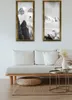 A living room scene with a sofa, coffee table, and artwork on the wall. Produktbild-Vorschau