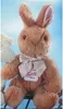 A plush toy rabbit is shown against a light blue background. Náhled obrázku produktu