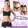 A woman is shown in athletic wear, with before and after images of weight loss, and a bracelet is displayed. Produktbild-Vorschau
