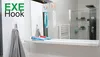 A bathroom scene featuring toothbrushes and a towel. Produktbild-Vorschau