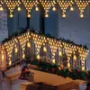 A balcony decorated with Christmas lights and garland. Náhled obrázku produktu