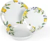 A set of three white ceramic plates and bowls decorated with a lemon and berry pattern, arranged on a white background. Anteprima dell’immagine prodotto