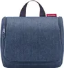A blue toiletry bag with a herringbone pattern is shown against a white background. Produktbild-Vorschau
