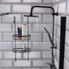A black metal shower caddy with toiletries hanging on a tiled wall in a shower. Náhled obrázku produktu