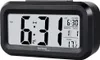 A black digital alarm clock with a white display showing the time, date, and temperature. Anteprima dell’immagine prodotto