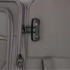 Close-up of a TSA combination lock on a grey suitcase. Produktbild-Vorschau