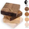 A stack of wooden blocks, each with a different wood finish, presented against a white background. Produktbild-Vorschau