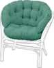 A teal cushion on a white rattan chair. Anteprima dell’immagine prodotto