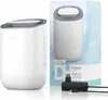 A product shot of a white dehumidifier and its packaging, along with its power adapter. Produktbild-Vorschau