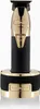A close-up studio shot of a gold and black BaByliss Pro hair trimmer on its charging stand. Anteprima dell’immagine prodotto