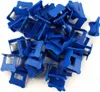 A pile of blue tile leveling clips. Náhľad obrázku produktu