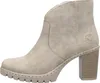 A side view of a beige ankle boot with a block heel. Produktbild-Vorschau
