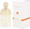 A bottle of Guerlain Aqua Allegoria Mandarine Basilic perfume and its packaging are displayed side-by-side against a white background. Voir les images du produit