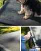 A collage of images showing a dog on a raised dog bed, a close-up of the bed's mesh fabric, and a hand holding the bed's frame. Anteprima dell’immagine prodotto