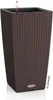 A tall, square, brown planter with a woven texture, featuring a water level indicator at the top. Náhled obrázku produktu