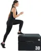 A woman is performing a step-up exercise on a plyometric box. Produktbild-Vorschau