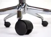 A close-up view of the casters and base of an office chair. Podgląd zdjęcia produktu