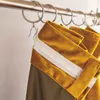 A close-up view of curtains hanging from a rod. Produktbild-Vorschau