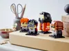 Four LEGO BrickHeadz figures of Harry Potter characters are displayed on a cardboard box. Produktbild-Vorschau