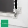 Close-up of a roller blind mechanism with a chain and a chain holder. Produktbild-Vorschau