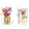 A product image showing a building block flower bouquet in a vase on the left and the product packaging on the right, with dimensions indicated. Produktbild-Vorschau
