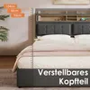 A bed with a headboard featuring storage shelves and USB ports, with measurement markings on the side. Produktbild-Vorschau