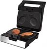 An open electric grill with two fish-shaped molds, one with two cooked pastries inside. Podgląd zdjęcia produktu