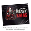 A graphic illustration of a skeleton Santa Claus playing a guitar, with Christmas trees and festive decorations, set against a dark, textured background. Text overlays read 'We wish you a HEAVY X-MAS'. Below the image, there is text in German describing ho Produktbild-Vorschau