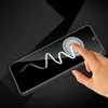 A hand is touching a smartphone screen with a protective glass film on it. A wavy line is drawn on the screen. Produktbild-Vorschau