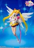 A promotional image of a Sailor Moon action figure with wings, set against a blue, starry background. Produktbild-Vorschau