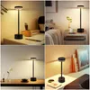 Collage of four lifestyle shots showing a black LED table lamp in different settings, such as a desk, bedside table, and shelf. Náhľad obrázku produktu