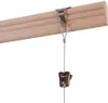 A close-up view of a picture hanging system attached to a wooden rail. Voir les images du produit
