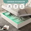 A bed with its storage compartment open, showing organized items inside. Produktbild-Vorschau