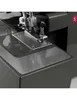 Close-up of a sewing machine's needle and presser foot area. Produktbild-Vorschau