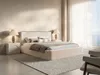 A bedroom scene with a bed, nightstands, lamps, and a rug. Produktbild-Vorschau