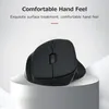 A black vertical mouse is displayed on a white pedestal against a light gray background. Voir les images du produit