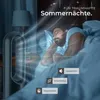 A man sleeping in bed with a fan in the background and text overlays. Produktbild-Vorschau