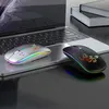 Two wireless mice are placed on a laptop keyboard, with a book in the background. Produktbild-Vorschau