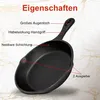 A black cast iron frying pan with labels pointing out its features. Produktbild-Vorschau