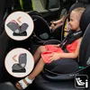 A child is sitting in a car seat in a car. Produktbild-Vorschau