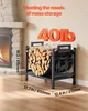 A black metal firewood rack filled with logs, placed next to a fireplace. Dimensions and weight capacity are indicated with text overlays. Produktbild-Vorschau